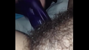 Hairy pussy fucked by dildo